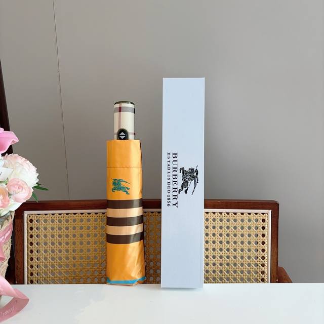 Burberry's tri-fold, self-folding umbrella is the pinnacle of the year. Classic,