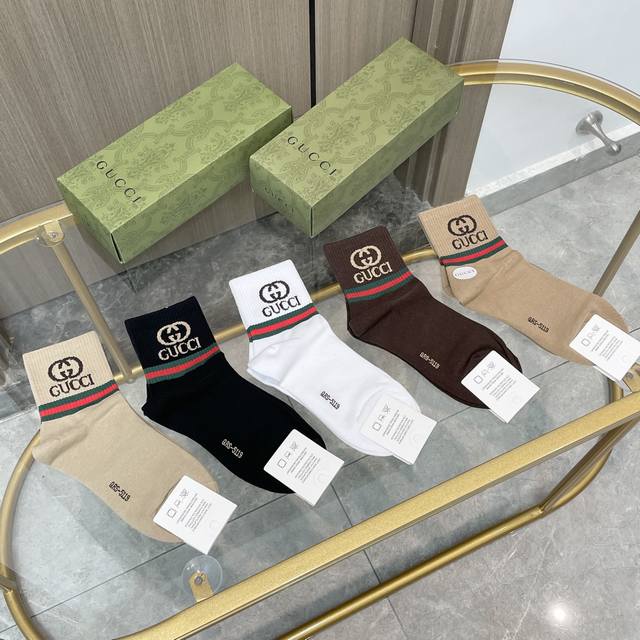 Comes with a box of five pairs of Gucci socks. They are so beautiful! European