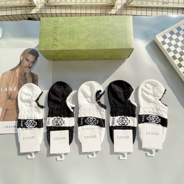 Comes with a box of five pairs of Gucci socks. They are so beautiful! European