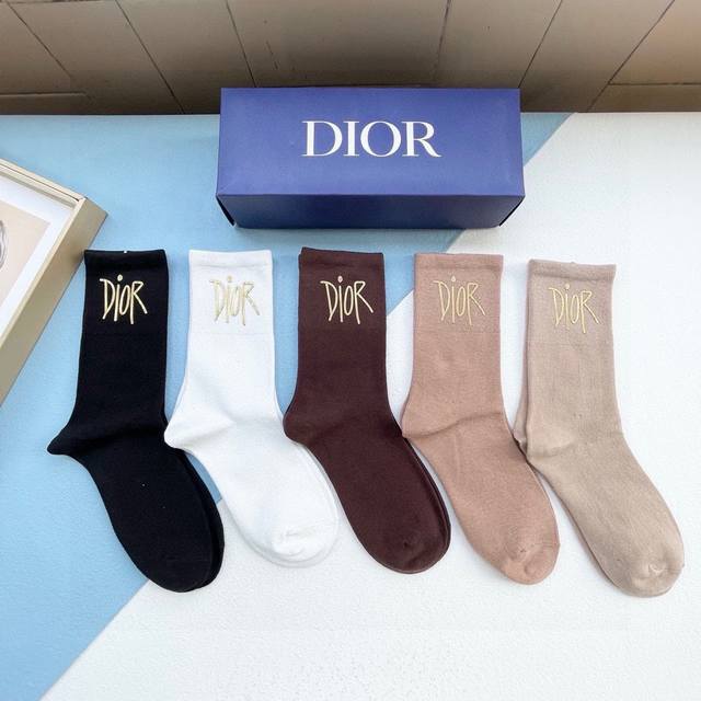 Comes in a box of five pairs of Dior's new gold-stamped, pure black short-tube