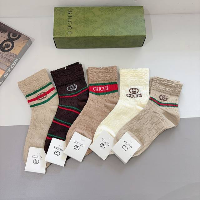 Comes with a box of 5 pairs of Gucci's new early fall mid-calf socks! Made of p