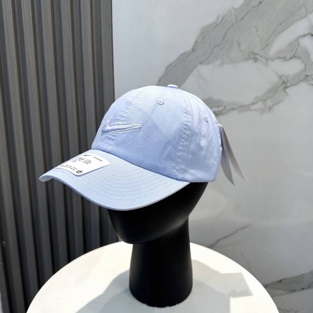 Nike embroidered logo cotton baseball cap. Cool tones give it a street-chic vib