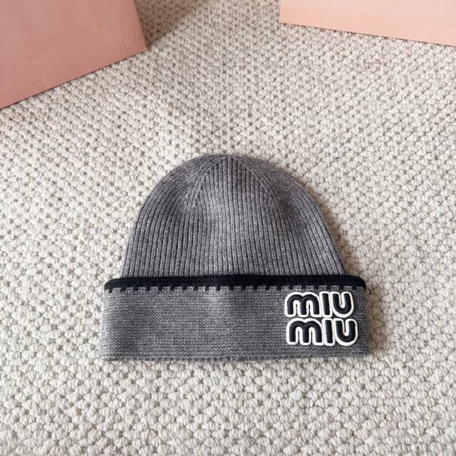 Miumiu new autumn and winter knitted wool hatThis is so cute! The earmuffs are s