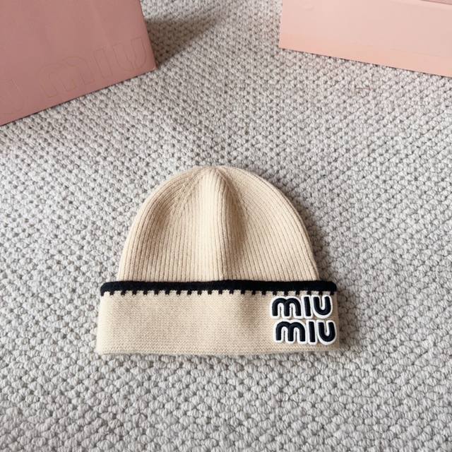Miumiu new autumn and winter knitted wool hatThis is so cute! The earmuffs are s