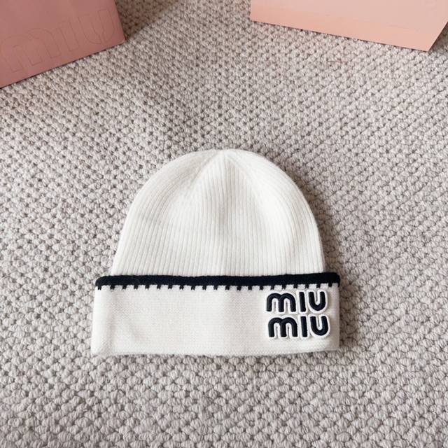 Miumiu new autumn and winter knitted wool hatThis is so cute! The earmuffs are s