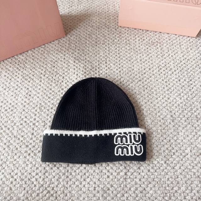 Miumiu new autumn and winter knitted wool hatThis is so cute! The earmuffs are s