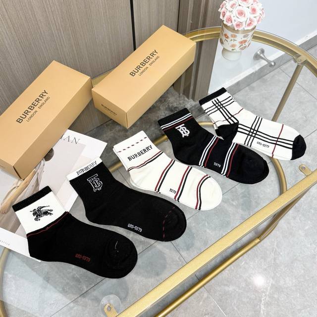 comes with a box of five pairs of Burberry's latest Bage mid-tube socks, the la