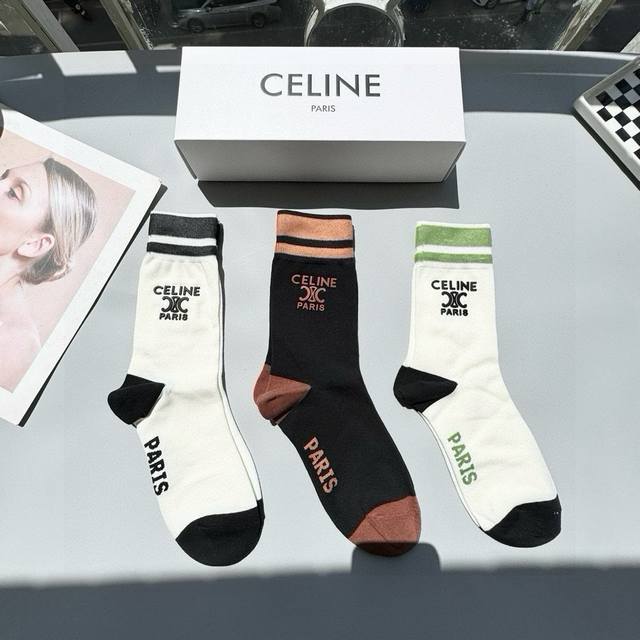 Comes with a box of three pairs of Celine's popular mid-calf socks in the tall