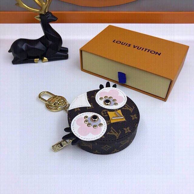 Original picture and packaging. Louis Vuitton love bird keychain and bag charm.