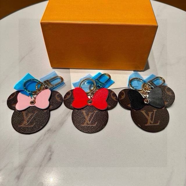 with original packaging. Louis Vuitton official website MP3750 Spade bag charm