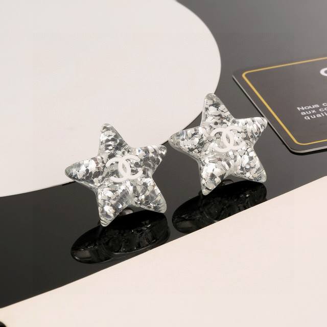 Today's new arrival: Chanel acrylic star silver sequined double C earrings. loo