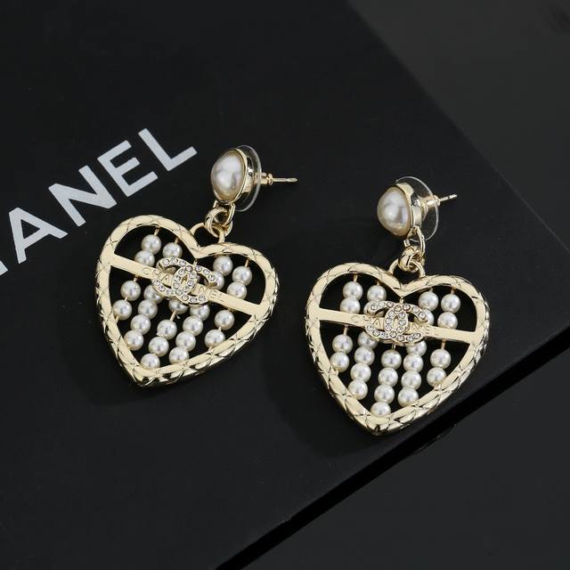 Chanel light gold heart peach earrings keep up with the trend for early spring