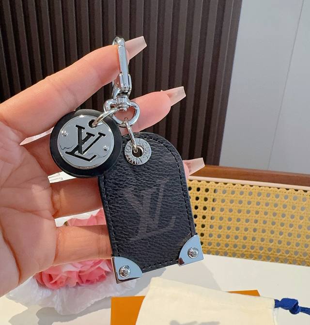 Louis Vuitton Lv Keychain Charm M641 Travel Tag bag charm and keychain embody th