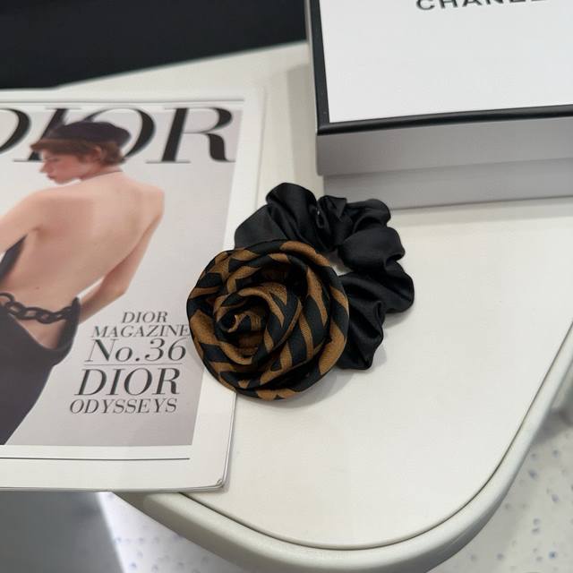 comes with a box. Fendi's new F hairband features a classic rose pattern. It's