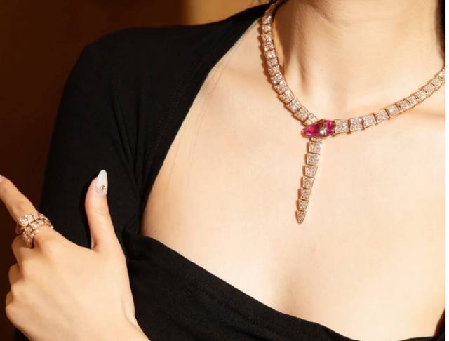 Bulgari's wide, high-grade red corundum and diamond-encrusted snake necklace, c