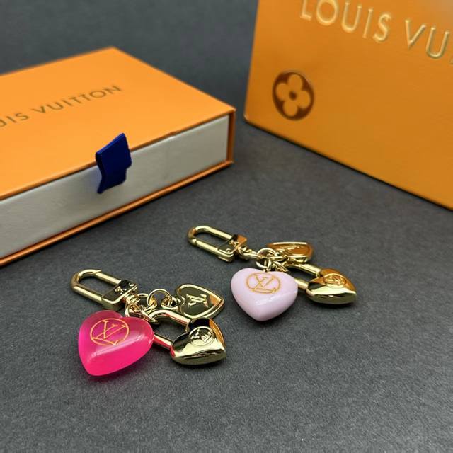 The Micro Charms Heart bag charm combines shimmering metal and colorful nylon,