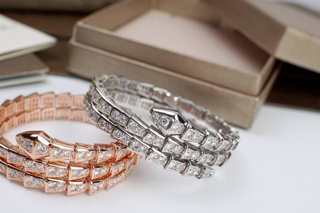 Bvlgari's double-loop, full-diamond snake bracelet features delicate and enchant