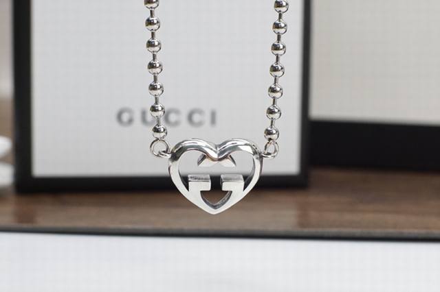 Gucci Double G Interlocking Heart Necklace The classic Double G logo is detailed
