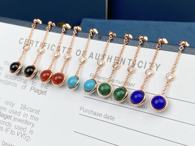 Piaget earrings are paired with black agate, carnelian, malachite, turquoise an