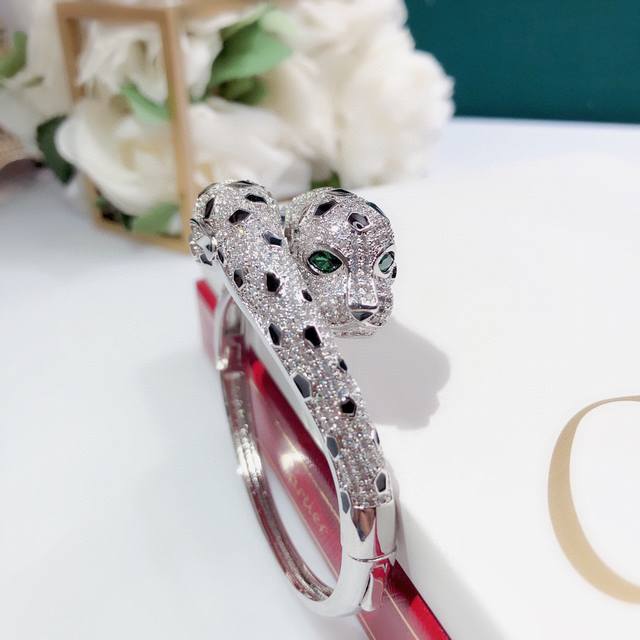 A striking, all-diamond, double leopard head bracelet. This Anth