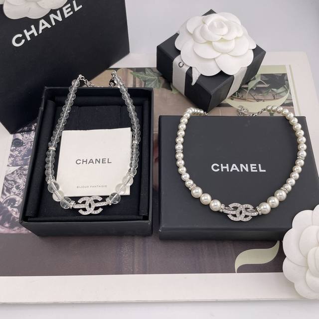 We offer a stunning, diamond-studded silver C pearl necklace with transparent b