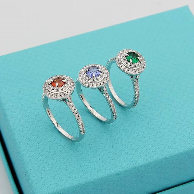 Tiffany solitaire ring, set with colored diamonds, shimmers with dazzling brilli