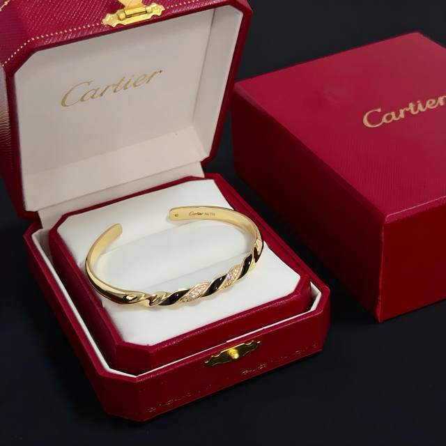 Cartier's high-end custom diamond-encrusted open bracelet features diamond-set c