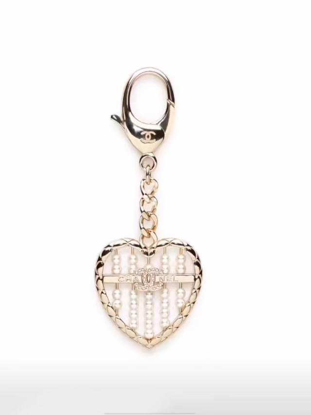 Chanel 25A new gold diamond-studded double C heart pearl abacus keychain . The