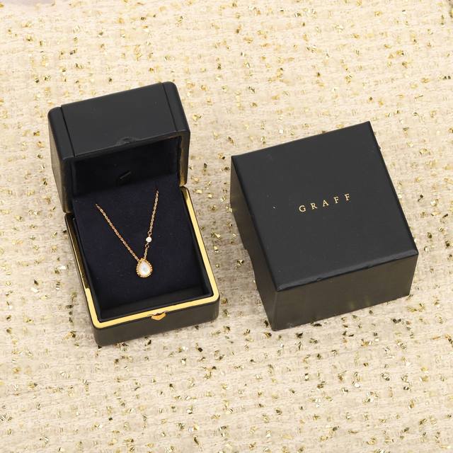 206877 We offer a small teardrop necklace, available in custom 18K gold with rea