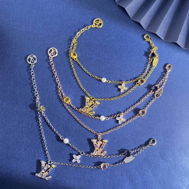 Lv Louis Vuitton fashion and light luxury Lv letter inlaid with colored diamonds