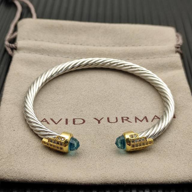 David Yurman 5mm gold-tipped, 5-row silver diamond bracelet. Blue diamonds, reco