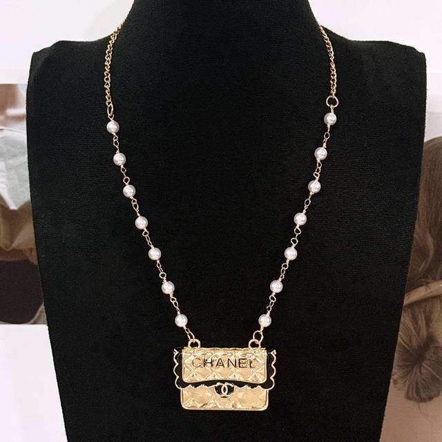 Shao Chanel bag pearl necklace