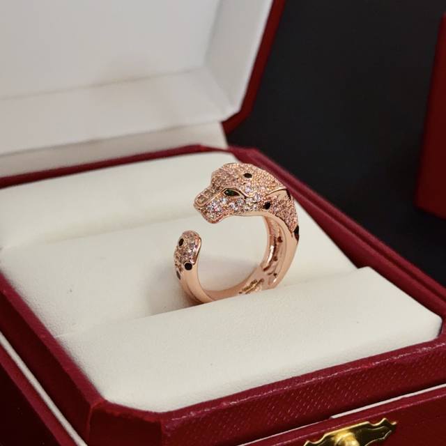 Cartier's high-end custom diamond-encrusted panther head ring features a classi
