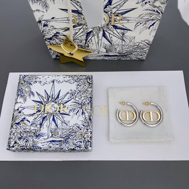 We offer D silver hoop and gold CD earrings, Z 4300, from our spring/summer col