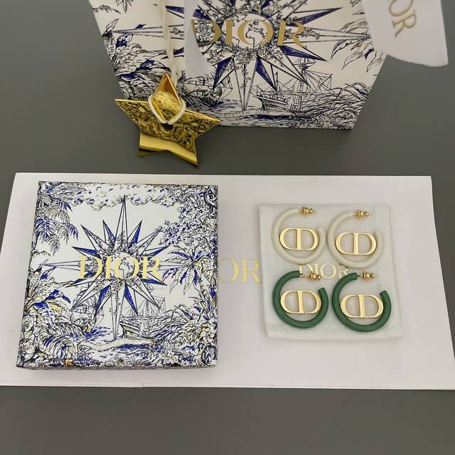 We offer D green and white hoop CD earrings for 4900, from our spring and summe