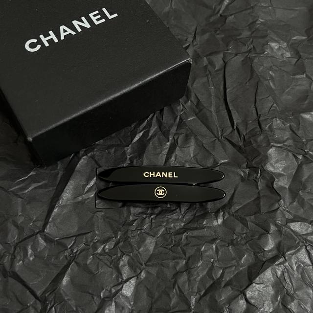 A pair of vintage Chanel hairpins . The bronze color is super stylish, paired w