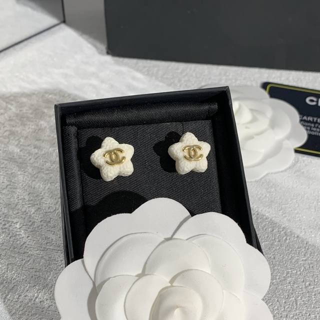 Chanel's star-shaped earrings, inspired by natural leaves, feature flowing line