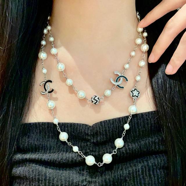 Chanel vintage sweater chain. Chanel's styles really need no introduction. Each