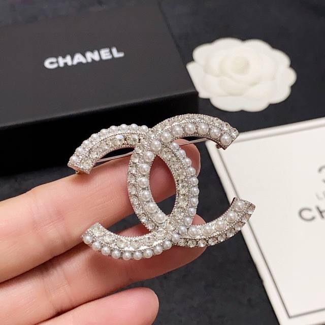 Chanel's new pearl and diamond brooch is a truly feminine accessory. Women who h