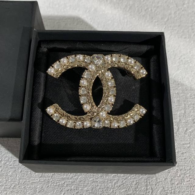 The Chanel Double C brooch is a symbol of classic style and fashion. Crafted fr