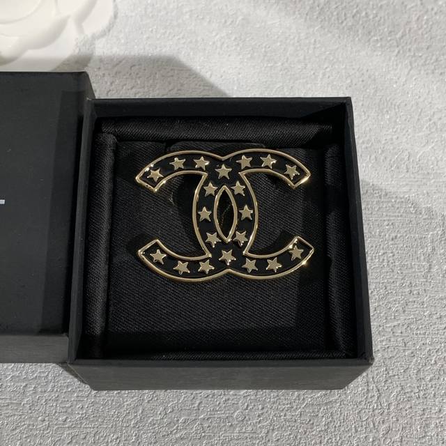 A Chanel brooch, a symbol of classic style and fashion. Crafted from high-karat