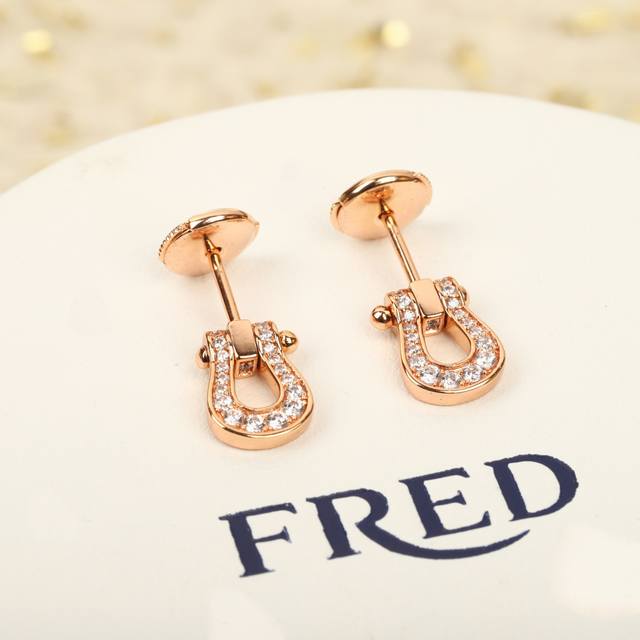 206931 We produce small horseshoe earrings, which can be customized with 18K rea