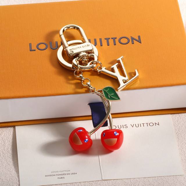 Donkey's new cherry keychain Wow! This cherry pendant is so beautiful! Louis Vu