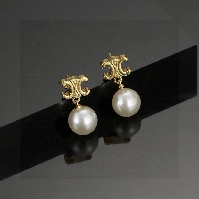 Celine's new Triumph pearl earrings are unique in design and full of personality