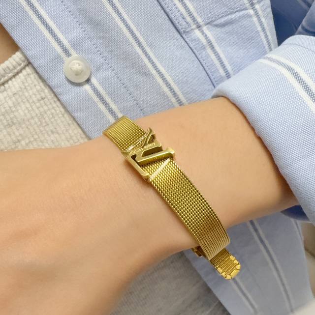 New, original, Louis Vuitton bracelet with engraved LV lettering and buckle. Ma