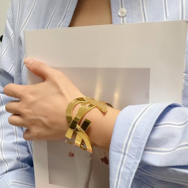 New Yves Saint Laurent wide bracelet with carved, hollowed-out lettering. Made