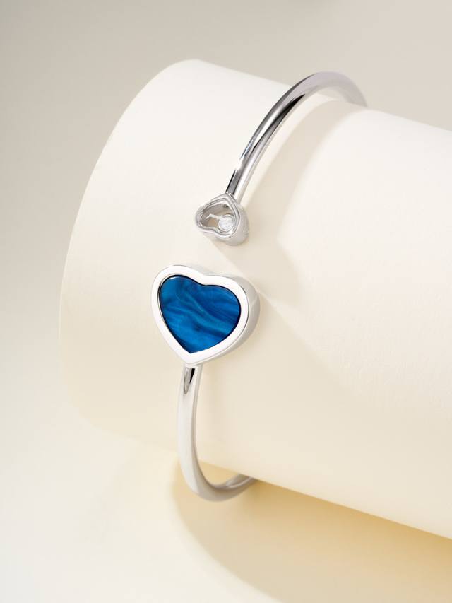 Blue Mother-of-Pearl Chopard Happy Hearts Flowers bracelet features Chopard's si