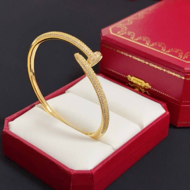 Cartier's high-end custom-made nail-studded bracelet features diamond-inlaid cra