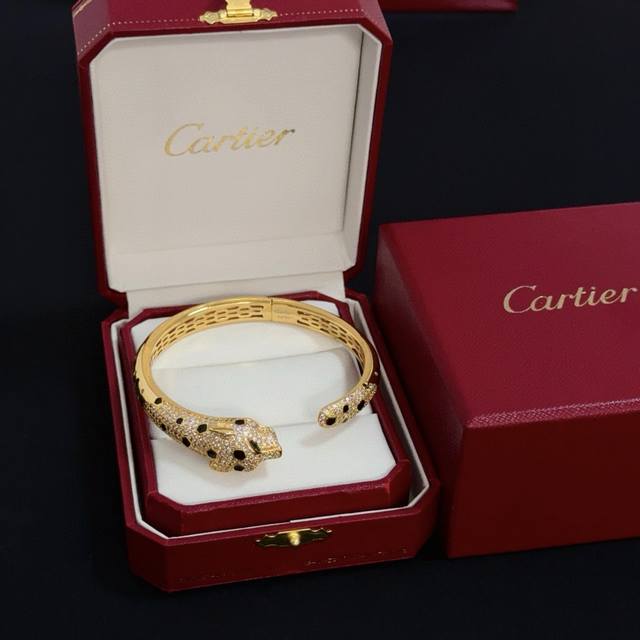 Cartier's high-end custom diamond-encrusted leopard bracelet features diamond-s