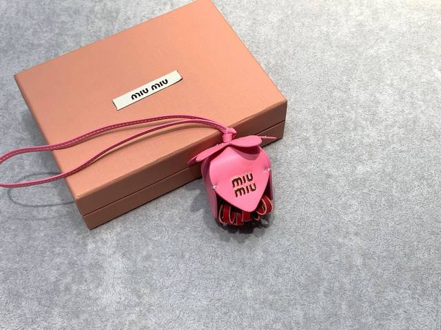 Miumiu floral pendant Calf leather design with flowers as a matching pendant bag